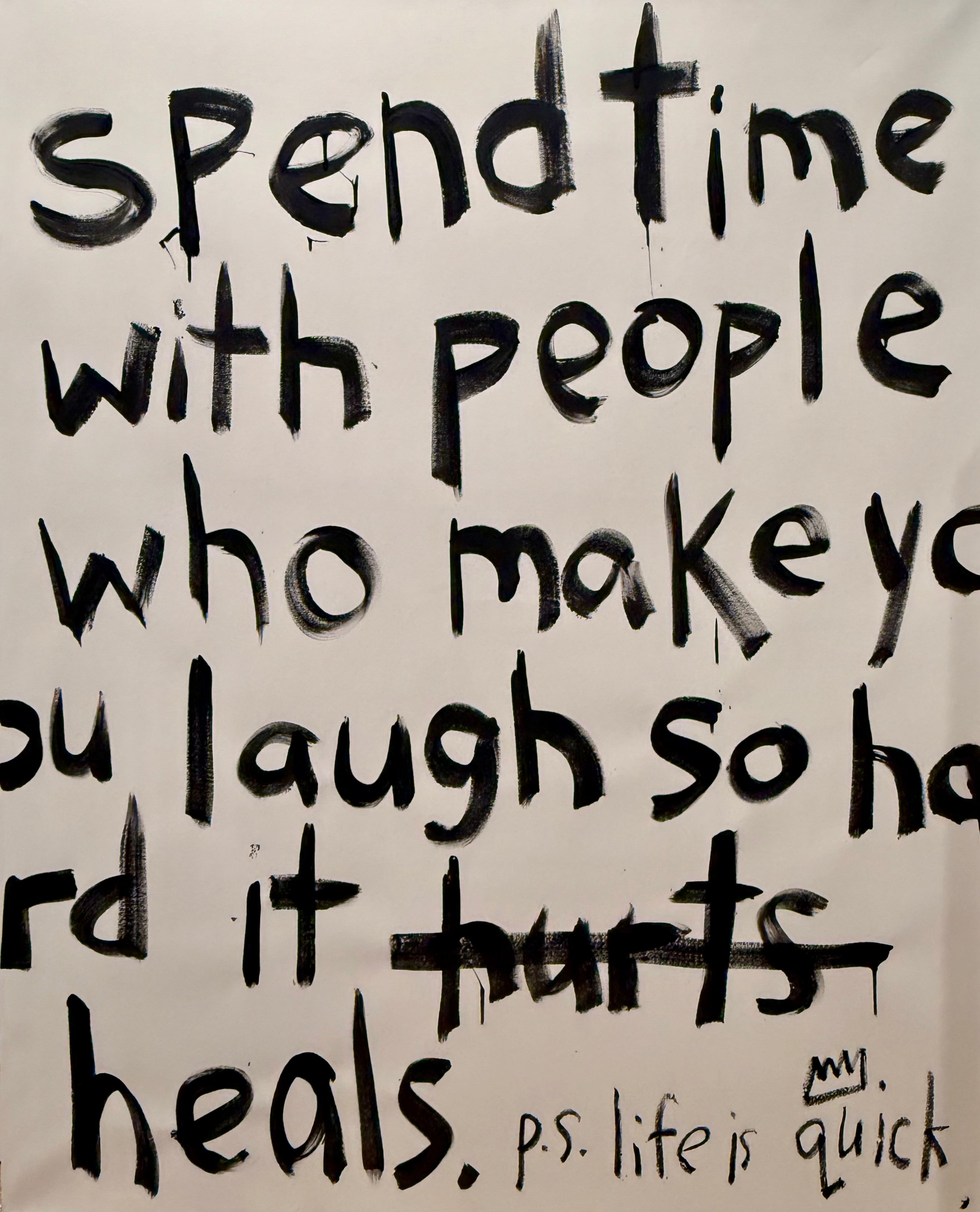 typography wall art featuring handwritten quote on a beige background.