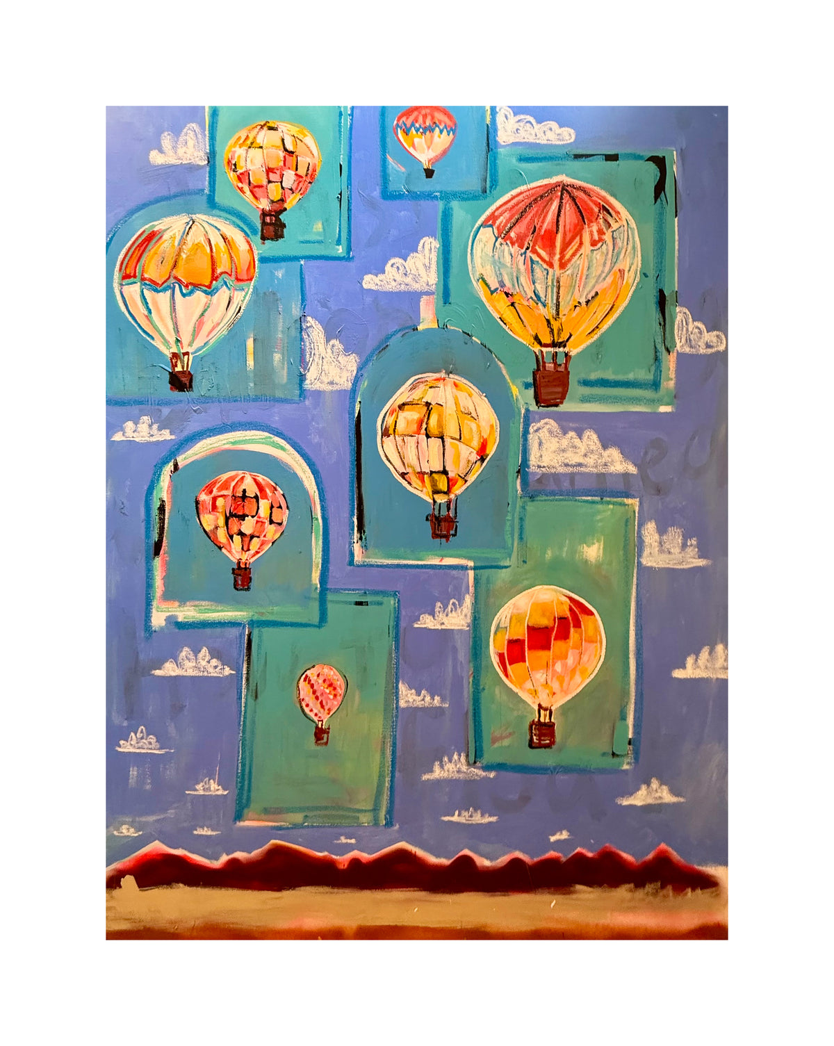 vintage hot air balloon print with multiple balloons, blue sky, clouds and landscape.