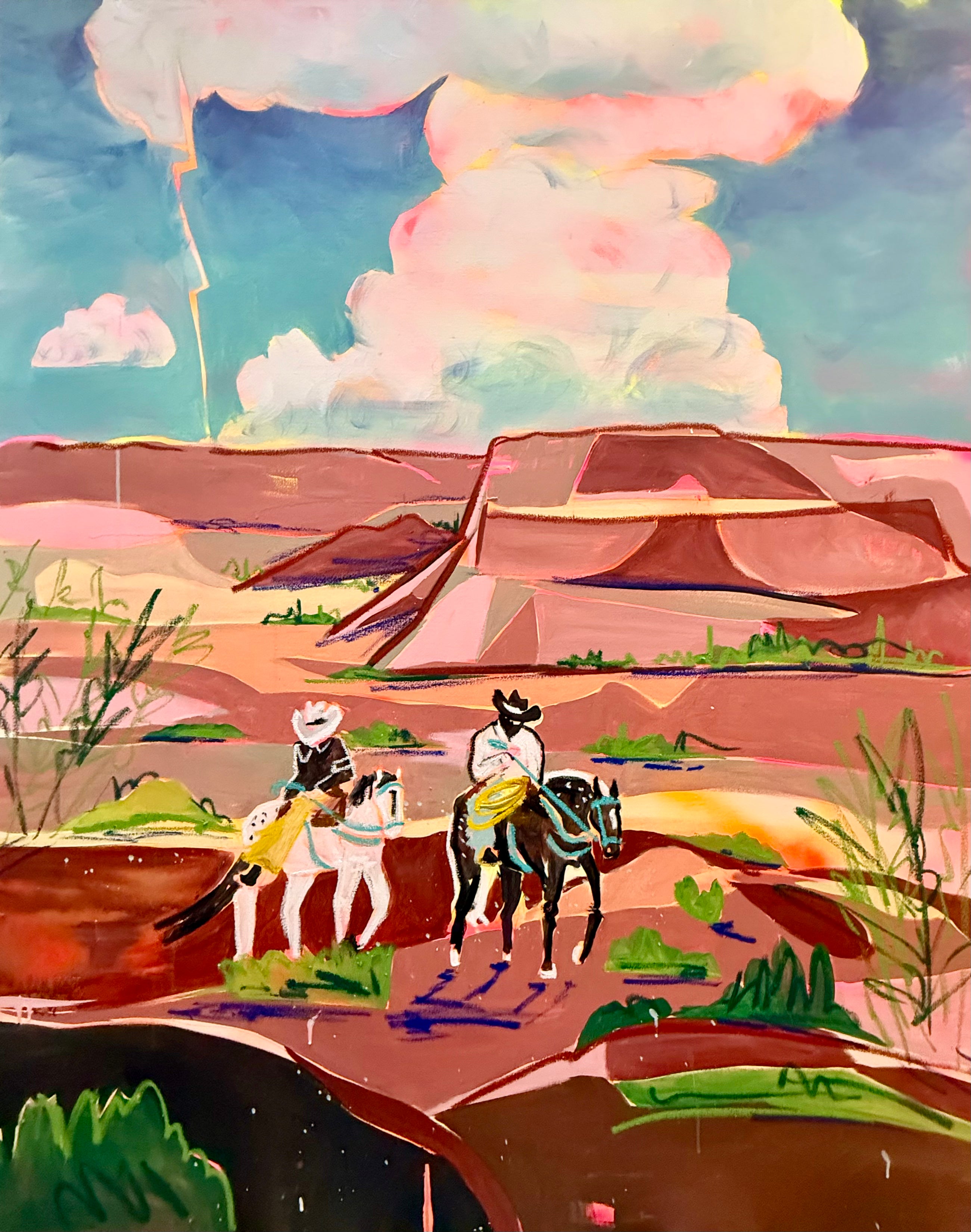 Colorful desert landscape with cowboys on horseback and a large mushroom cloud in the sky.